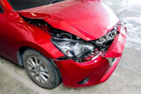 Vehicle with front-end collision damage (placeholder image)